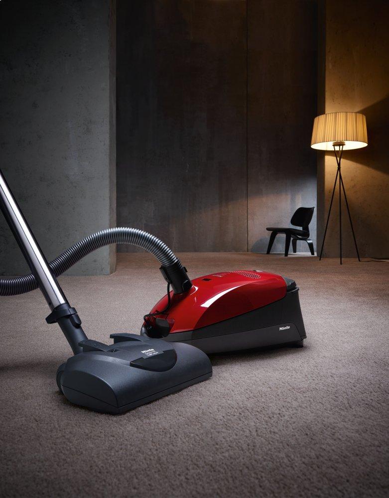 Miele CLASSIC C1 HOME CARE POWERLINE SBCN 0MANGO RED Classic C1 Home Care Powerline – Sbcn0 – Bodenstaubsauger mit Elektrobürste für die gründliche Reinigung von strapazierfähigen Teppichen.